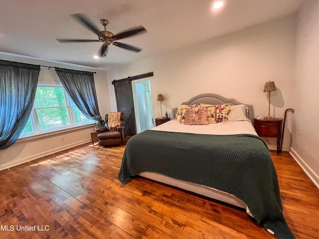 110 Quail Hollow Pl, Brandon, MS 39047 - bedroom featuring baseboards, a barn door, wood finished floors, recessed lighting, and a ceiling fan