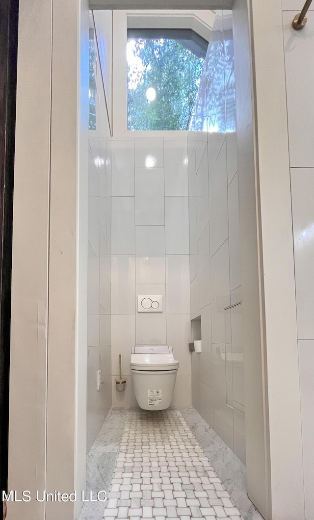 110 Quail Hollow Pl, Brandon, MS 39047 - bathroom featuring toilet and tile walls