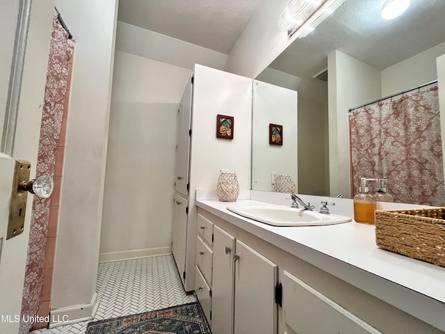 bathroom with vanity and tile patterned flooring