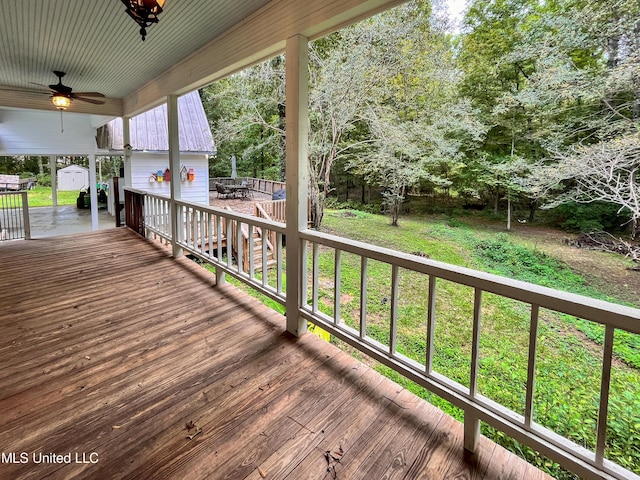 110 Quail Hollow Pl, Brandon, MS 39047 - wooden deck featuring a ceiling fan, outdoor dining area, and a lawn