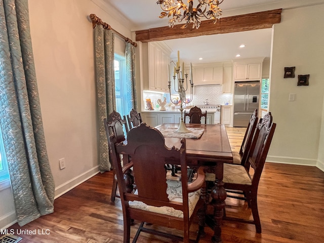 dining space with a notable chandelier, beamed ceiling, and dark wood-type flooring