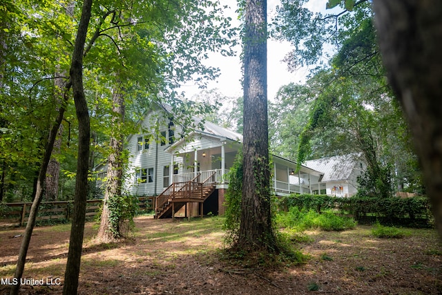 view of yard featuring a wooden deck