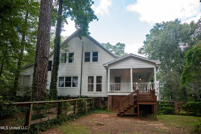 rear view of property with a porch