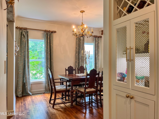 dining room with ornamental molding, dark hardwood / wood-style floors, and plenty of natural light