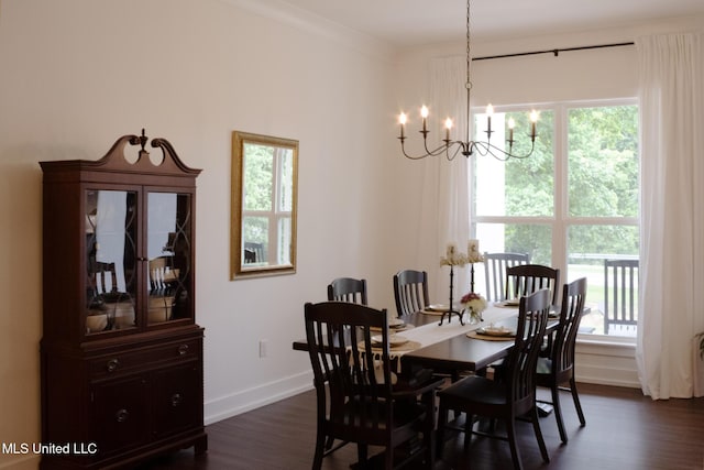 691 Apona St, Diamondhead, MS 39525 - dining area with a chandelier, baseboards, and dark wood-type flooring