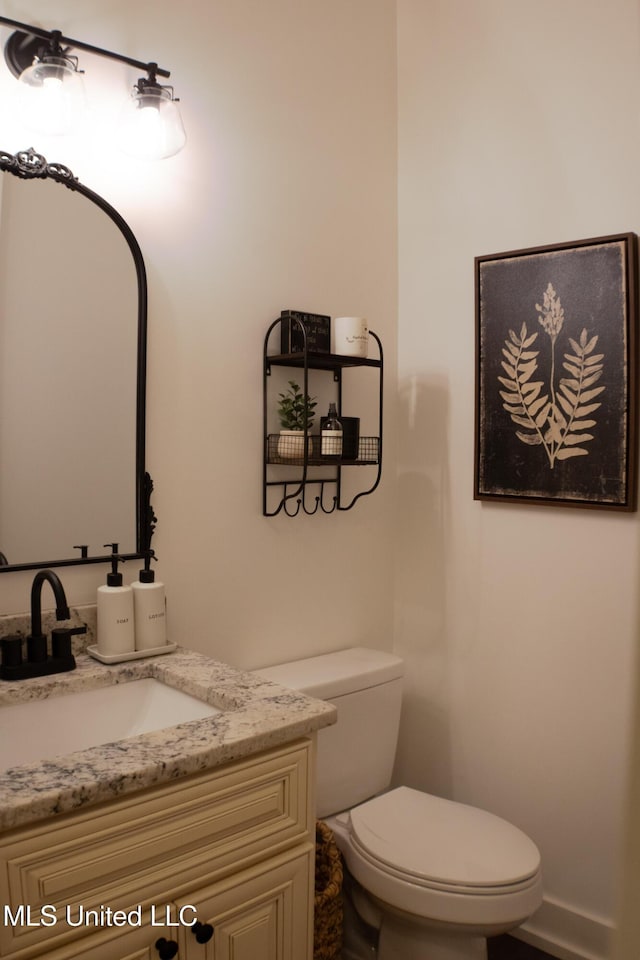 691 Apona St, Diamondhead, MS 39525 - bathroom with toilet and vanity