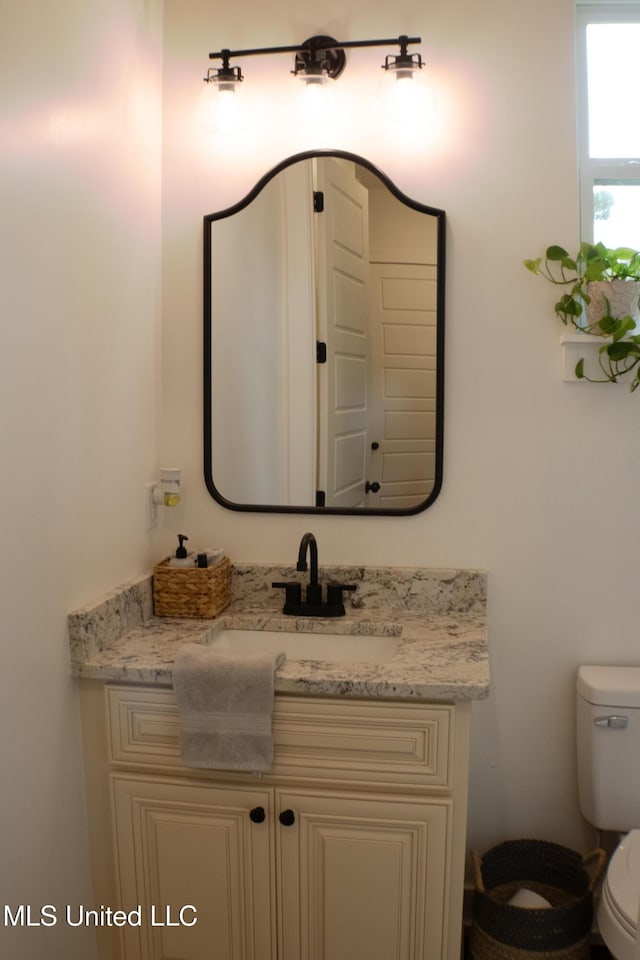 691 Apona St, Diamondhead, MS 39525 - half bathroom with toilet and vanity