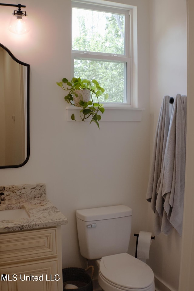 691 Apona St, Diamondhead, MS 39525 - bathroom featuring toilet and vanity