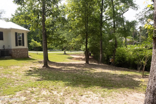 691 Apona St, Diamondhead, MS 39525 - view of green lawn with central air condition unit