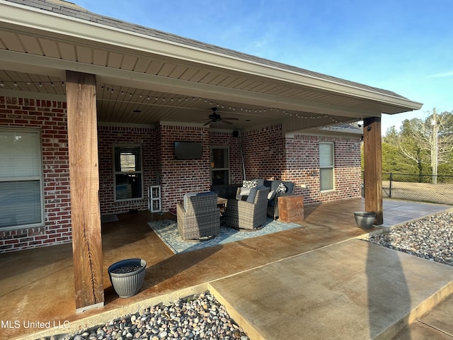 view of patio / terrace featuring a ceiling fan, fence, and an outdoor hangout area