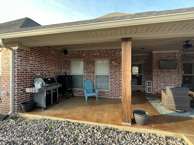 view of patio / terrace featuring a grill and ceiling fan