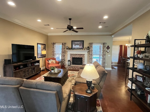 living area with ornamental molding, a fireplace, visible vents, and a healthy amount of sunlight