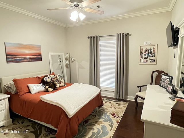 bedroom featuring visible vents, baseboards, dark wood-type flooring, and crown molding