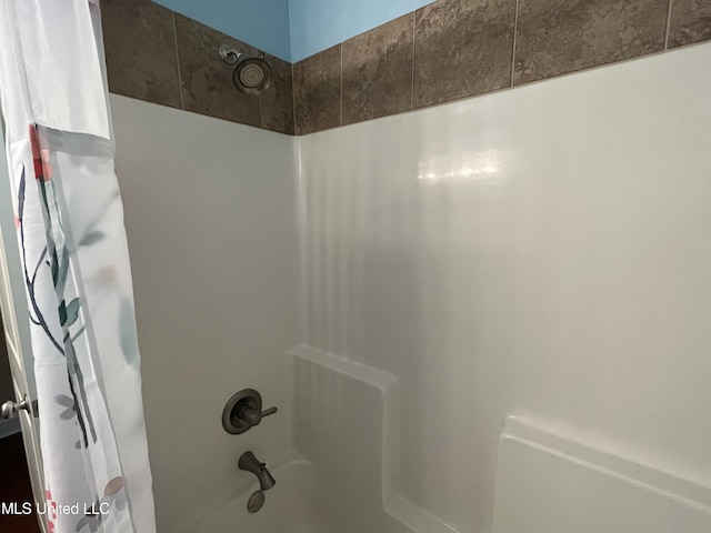 room details with shower / bath combination with curtain