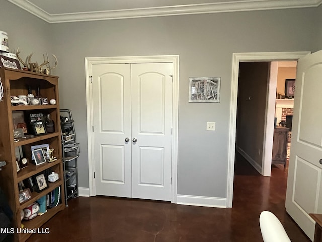 bedroom with a closet, crown molding, and baseboards