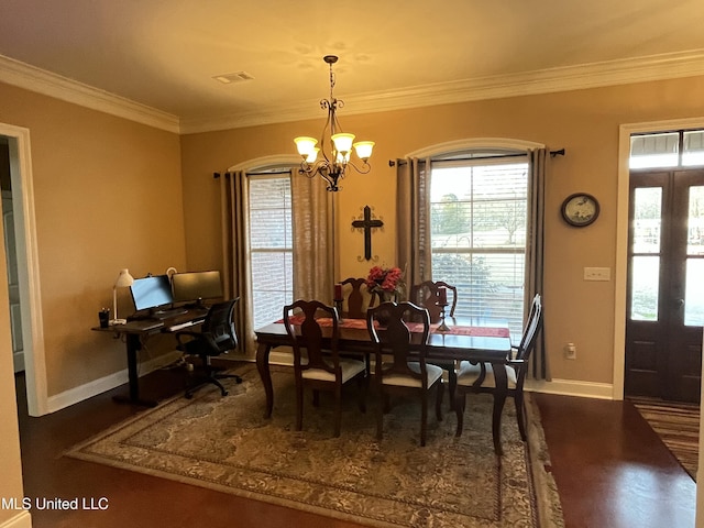 dining room with baseboards, visible vents, dark wood-style floors, crown molding, and a chandelier