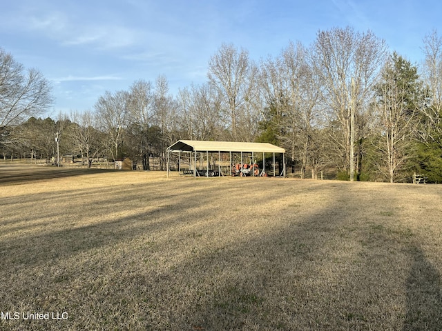 exterior space featuring a carport and a lawn