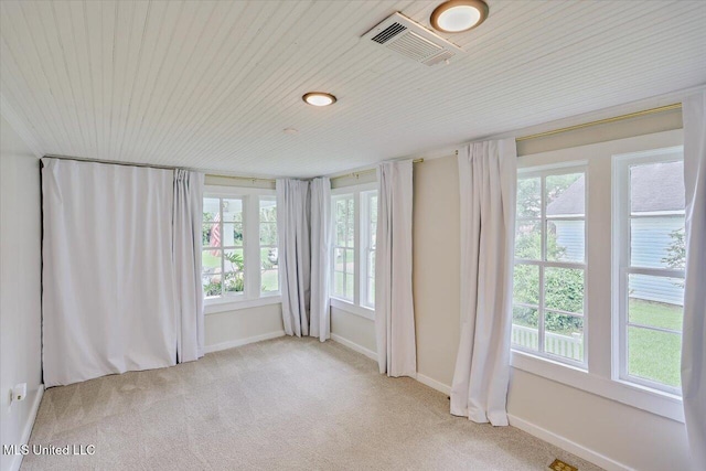 322 NW 2nd Ave, Magee, MS 39111 - empty room with light colored carpet and wood ceiling
