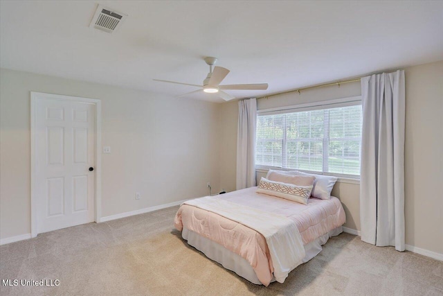322 NW 2nd Ave, Magee, MS 39111 - bedroom with light carpet and ceiling fan