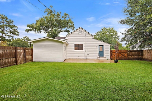 322 NW 2nd Ave, Magee, MS 39111 - back of house with a patio area, a fenced backyard, and a gate