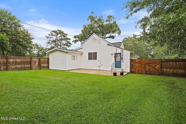 322 NW 2nd Ave, Magee, MS 39111 - back of property featuring a patio, a fenced backyard, and a gate