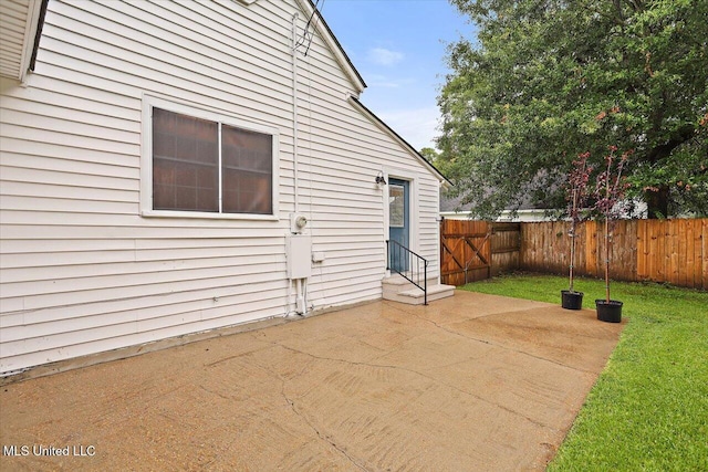322 NW 2nd Ave, Magee, MS 39111 - fenced backyard featuring a patio and entry steps