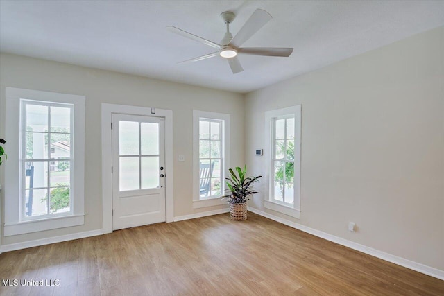 322 NW 2nd Ave, Magee, MS 39111 - doorway to outside featuring light wood-style floors and a ceiling fan
