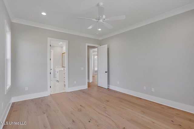 unfurnished bedroom featuring ensuite bath, crown molding, light hardwood / wood-style flooring, and ceiling fan