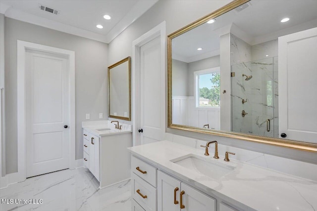 bathroom with vanity and a shower with door