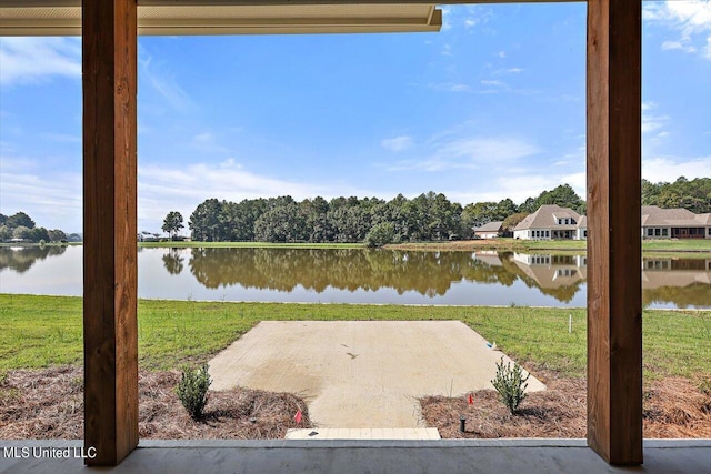 exterior space with a patio area and a water view