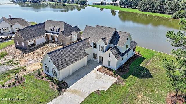 birds eye view of property with a water view