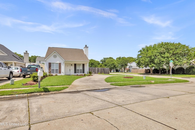 2390 Carter Rd, Biloxi, MS 39531 - view of front facade with driveway and a chimney