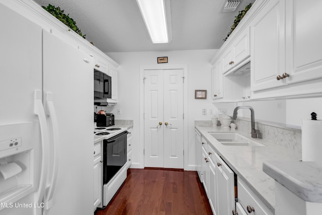 2390 Carter Rd, Biloxi, MS 39531 - kitchen with white appliances, a sink, dark wood finished floors, white cabinets, and light stone counters