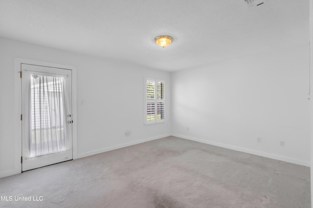 2390 Carter Rd, Biloxi, MS 39531 - carpeted empty room with baseboards