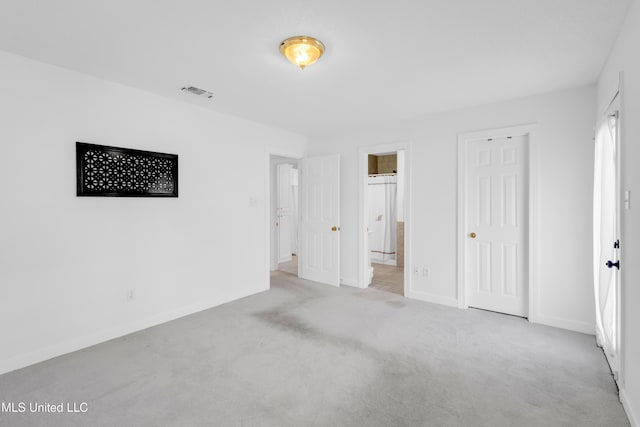 2390 Carter Rd, Biloxi, MS 39531 - unfurnished bedroom featuring carpet flooring, baseboards, and ensuite bath