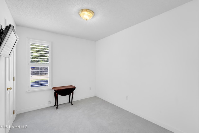 2390 Carter Rd, Biloxi, MS 39531 - carpeted empty room featuring a textured ceiling and baseboards