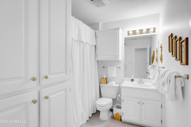 2390 Carter Rd, Biloxi, MS 39531 - bathroom with vanity, toilet, a textured ceiling, and a shower with shower curtain