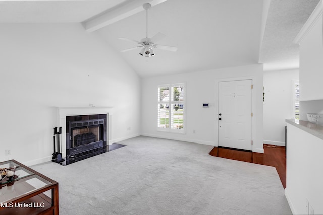 2390 Carter Rd, Biloxi, MS 39531 - unfurnished living room featuring carpet floors, a fireplace with flush hearth, beam ceiling, ceiling fan, and baseboards