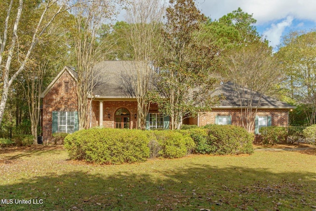 54 Saint Annes Dr, Hattiesburg, MS 39401 - view of front of home featuring brick siding and a front yard