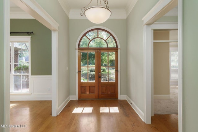 54 Saint Annes Dr, Hattiesburg, MS 39401 - foyer entrance featuring wood-type flooring, plenty of natural light, crown molding, and french doors