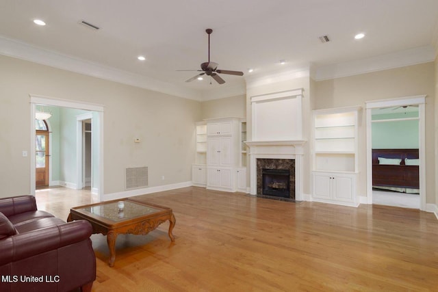 54 Saint Annes Dr, Hattiesburg, MS 39401 - living area featuring ceiling fan, ornamental molding, light wood-style floors, a high end fireplace, and recessed lighting