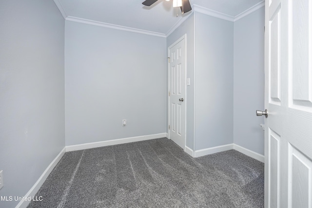 carpeted empty room featuring ceiling fan and crown molding