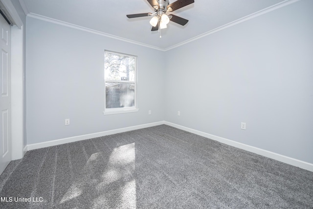 spare room with ceiling fan, ornamental molding, and carpet flooring