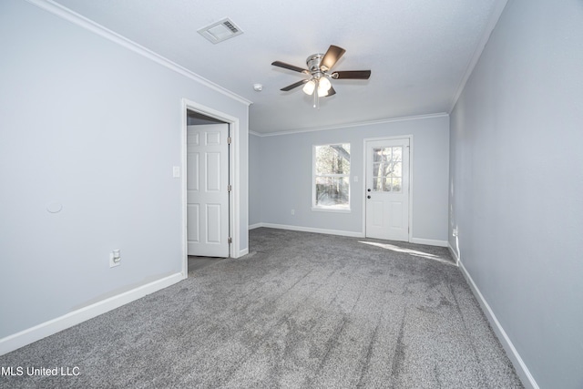 unfurnished room with ceiling fan, ornamental molding, and carpet floors