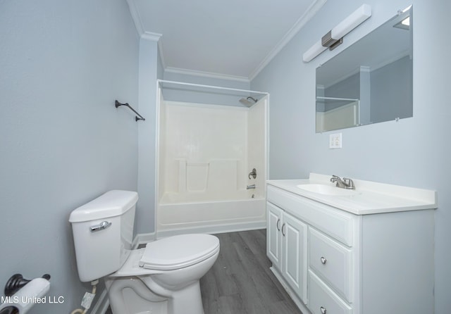 full bathroom with toilet, vanity, crown molding, hardwood / wood-style flooring, and bathtub / shower combination