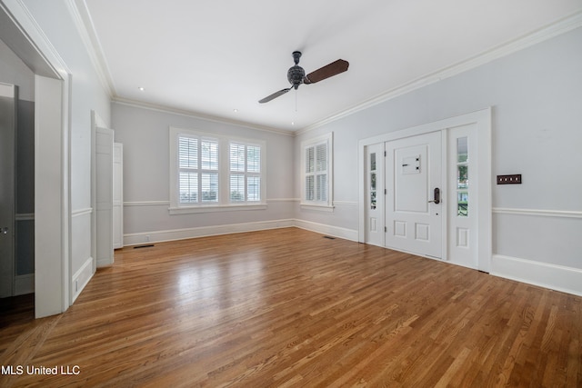 905 Franklin St, Corinth, MS 38834 - foyer entrance with wood finished floors, ornamental molding, a ceiling fan, and baseboards