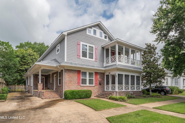 905 Franklin St, Corinth, MS 38834 - view of front facade with a balcony and brick siding
