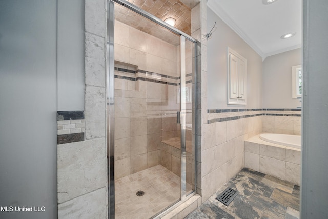 905 Franklin St, Corinth, MS 38834 - bathroom with crown molding, tile walls, a stall shower, a garden tub, and recessed lighting