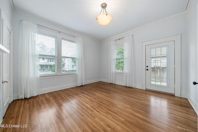 905 Franklin St, Corinth, MS 38834 - unfurnished room with crown molding, light wood-type flooring, and baseboards