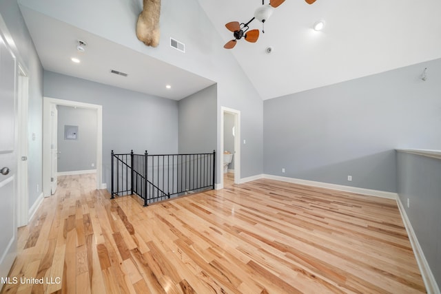 905 Franklin St, Corinth, MS 38834 - spare room featuring wood finished floors, a ceiling fan, baseboards, and high vaulted ceiling